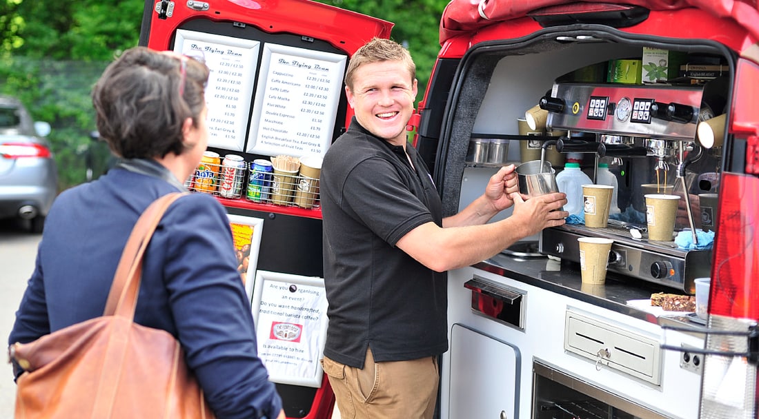 The Flying Bean Café team and red coffee van